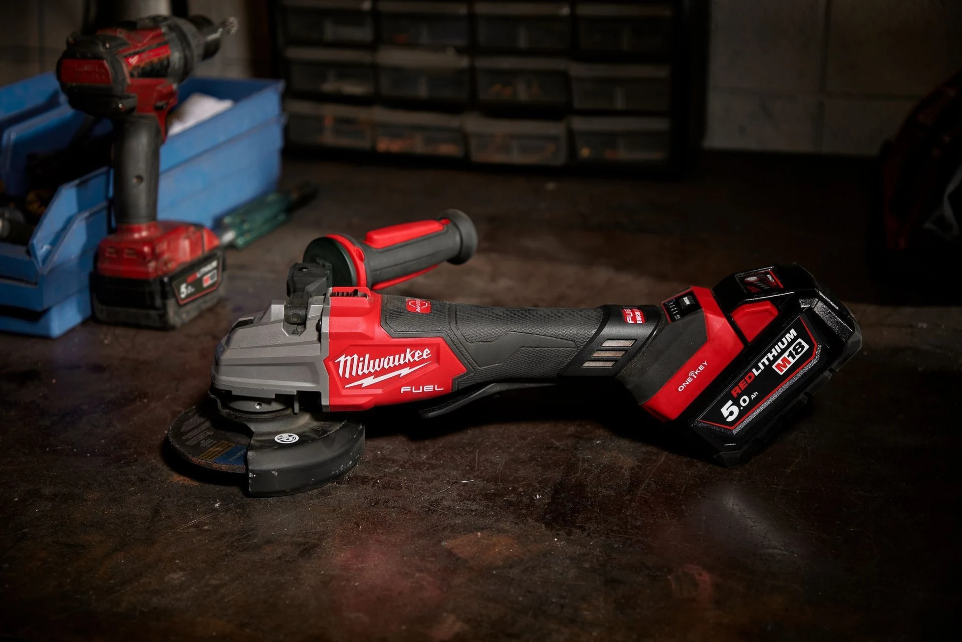 Milwaukee M18 FUEL angle grinder on a workshop bench